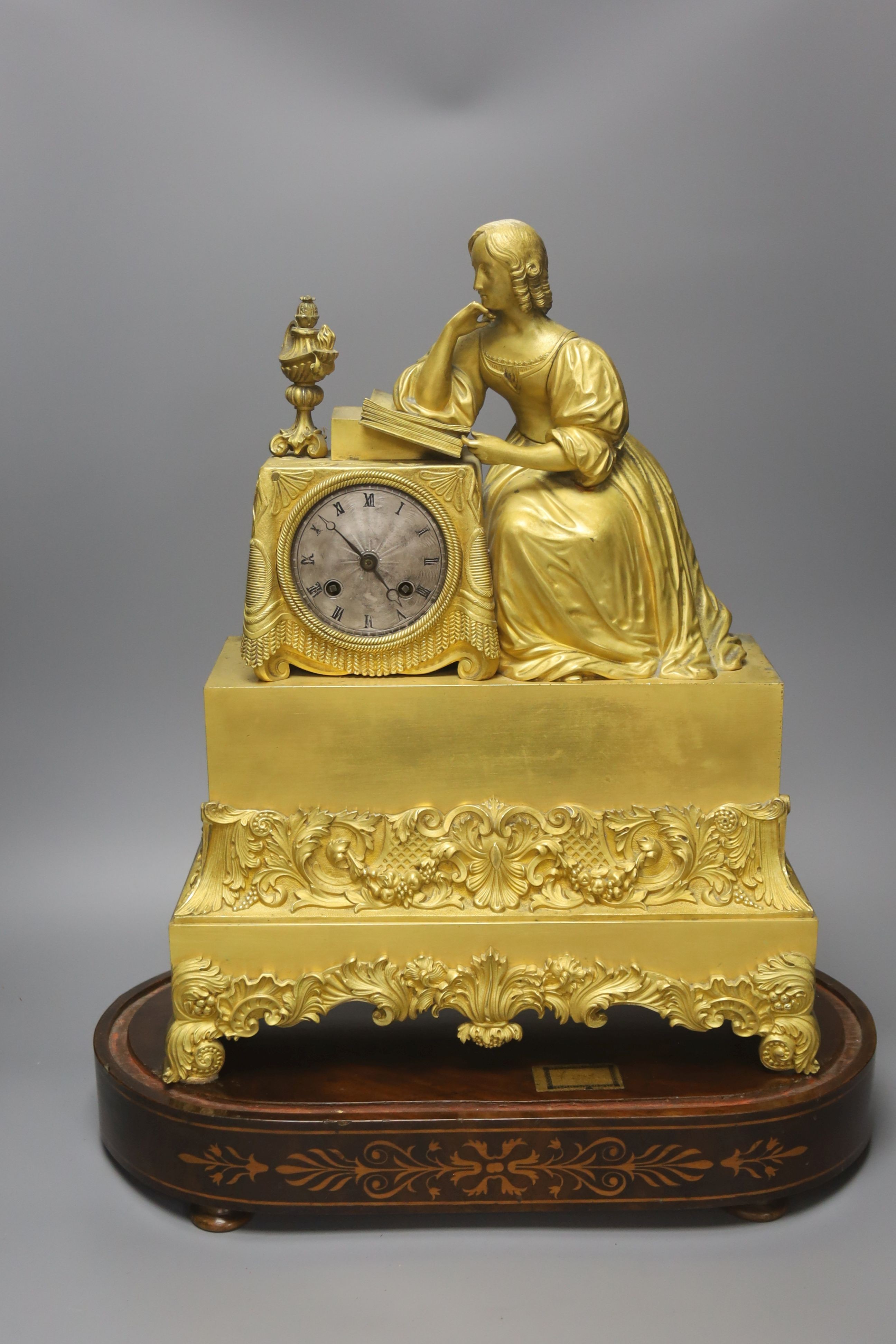 A 19th century French ormolu mantel clock (lacking pendulum), under glass dome and marquetry inlaid stand 54cm